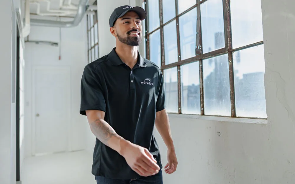 Assorted custom Nike corporate apparel and accessories, featuring branded Nike polos and caps.