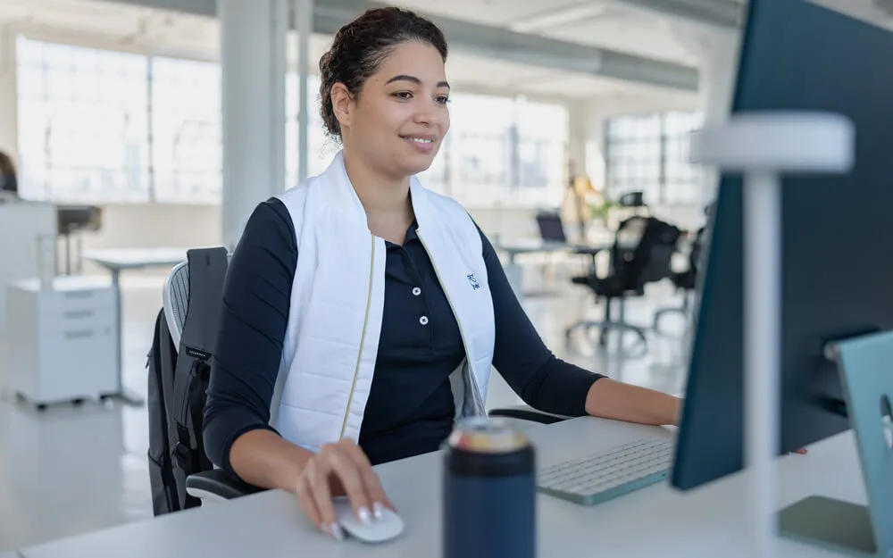Women's company apparel featuring customized, branded corporate apparel with logo details.