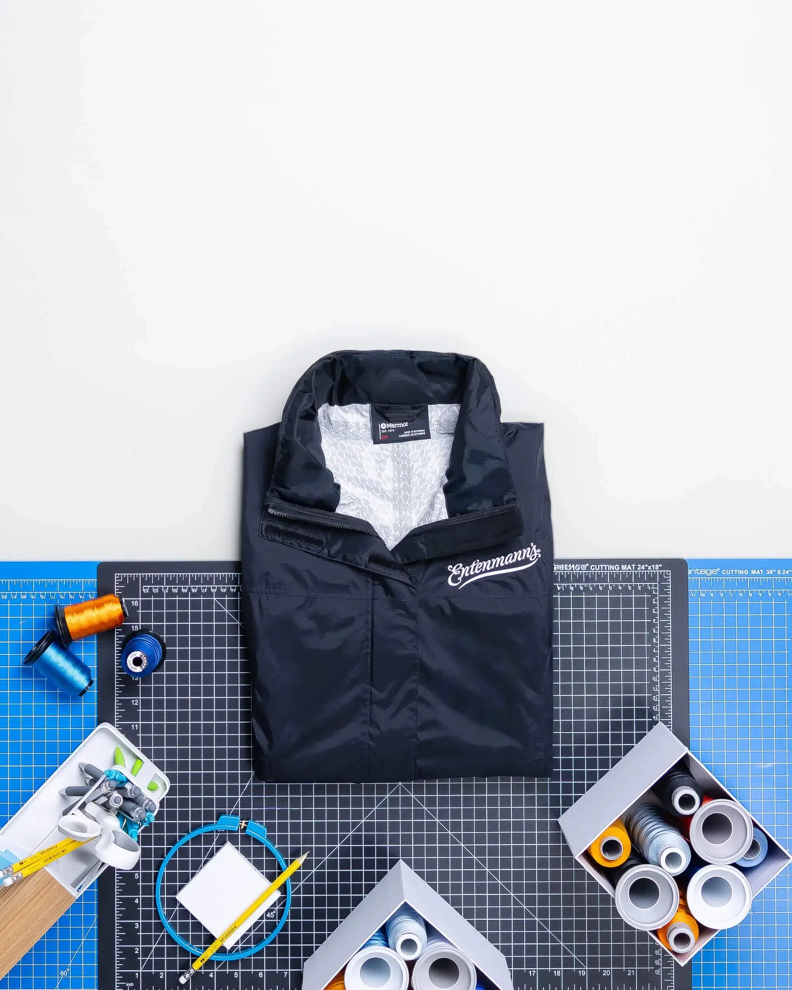 Custom Embroidered Apparel. Helly Hansen Raincoats. Helly Hansen Duffle Bags.