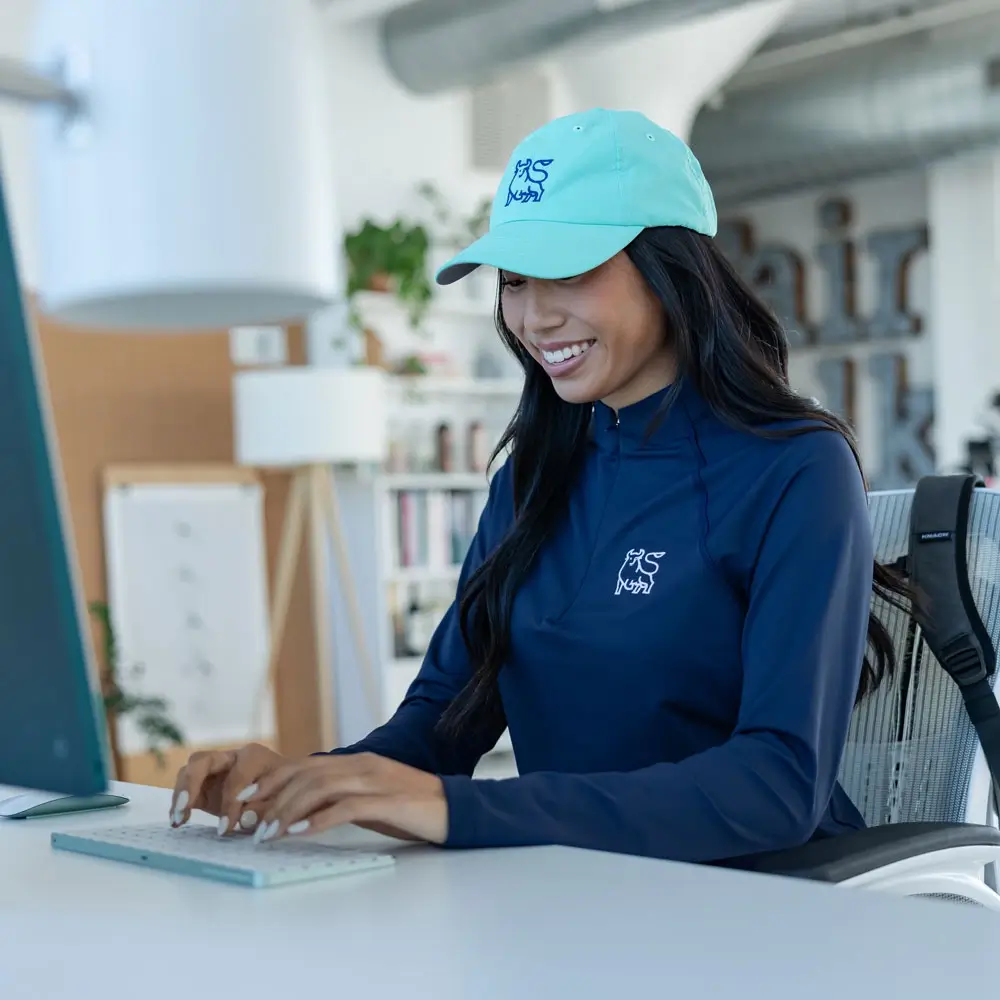 Women's company apparel featuring customized, branded corporate apparel with logo details.